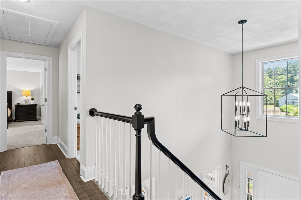 69 Curzon Mill Road Newburyport, MA 01950 - Photo 22 of 40 a view of a hallway with paintings on the walls