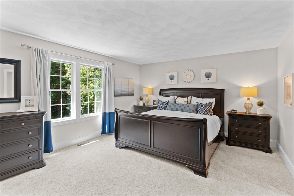 69 Curzon Mill Road Newburyport, MA 01950 - Photo 23 of 40 a bed room with a bed and a window