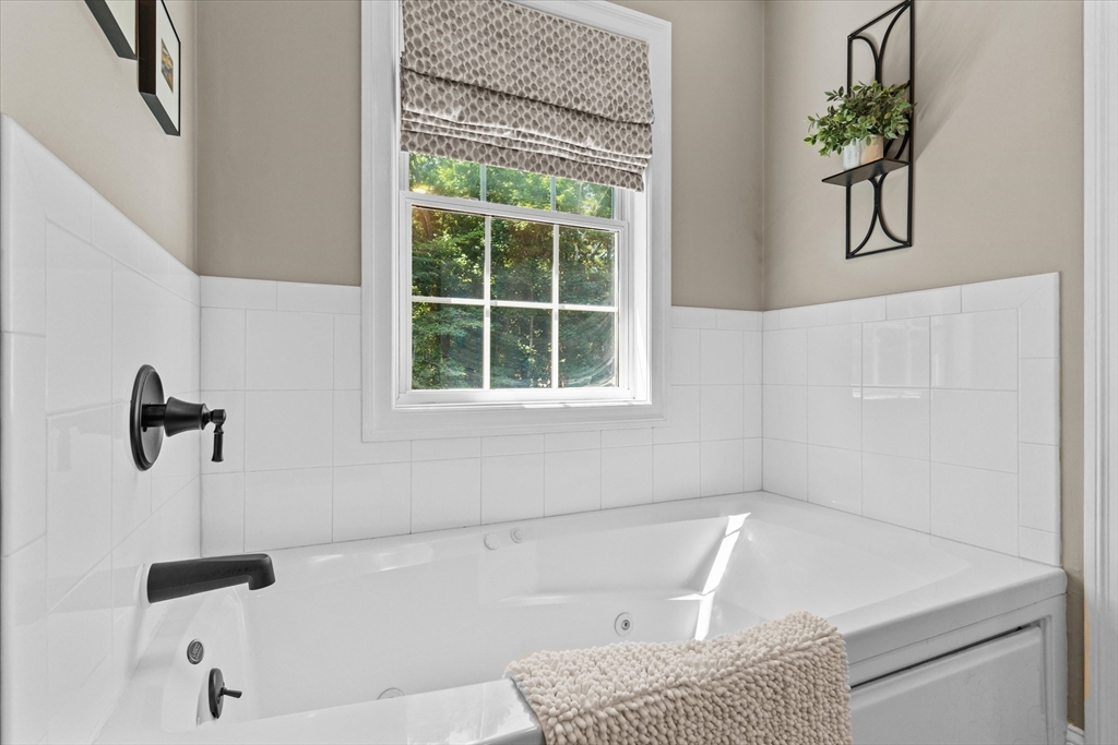 69 Curzon Mill Road Newburyport, MA 01950 - Photo 25 of 40 a bathroom with a tub