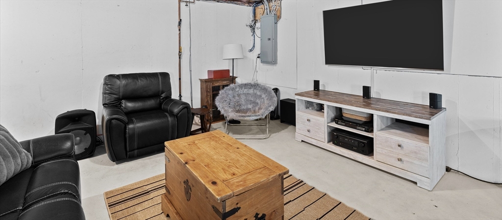 69 Curzon Mill Road Newburyport, MA 01950 - Photo 33 of 40 a living room with furniture and a flat screen tv