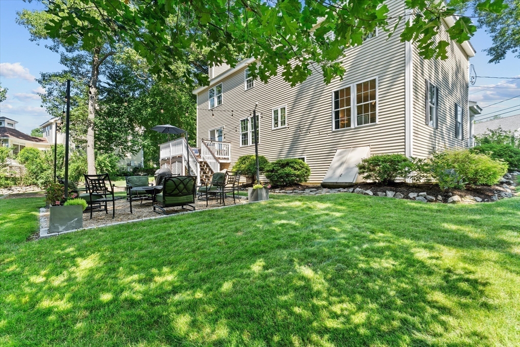 69 Curzon Mill Road Newburyport, MA 01950 - Photo 38 of 40 a front view of a house with a yard and outdoor seating