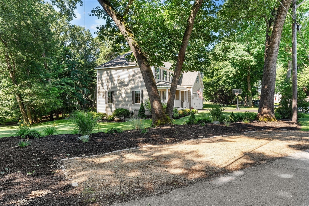 69 Curzon Mill Road Newburyport, MA 01950 - Photo 39 of 40 a front view of a house with garden