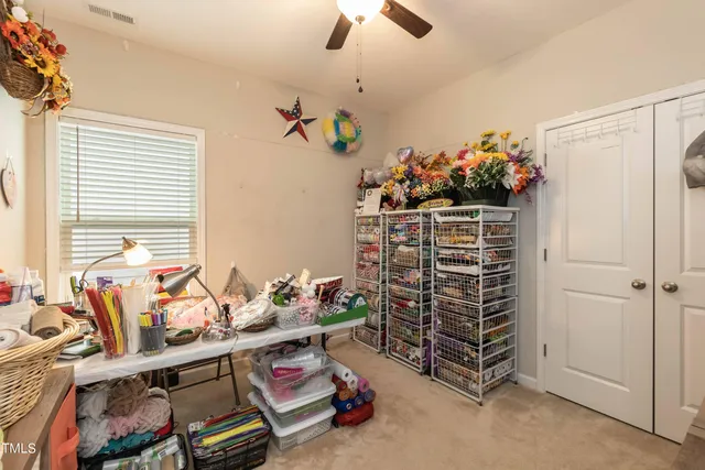 a dining room filled with lots of furniture and wooden floor
