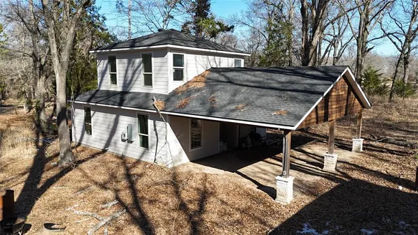 a view of a house with wooden stairs