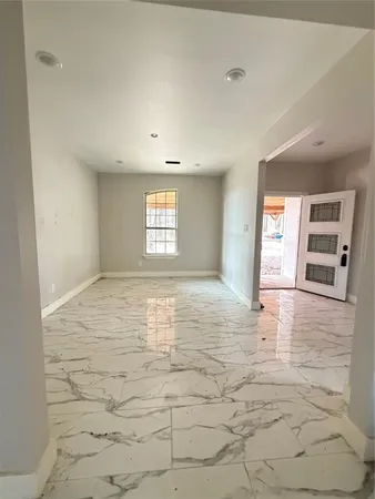 a view of an empty room and window