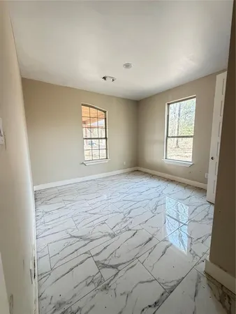 a view of an empty room and window