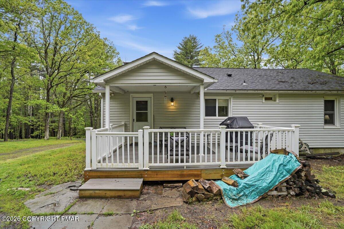 232 Garrity Road Hawley, PA 18428 - Photo 8 of 57 a view of a deck with a bench
