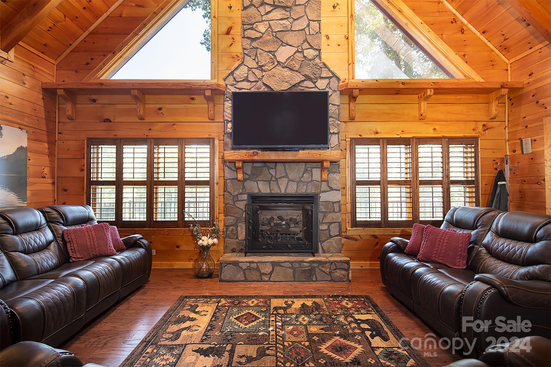 303 Lakeview Road Mocksville, NC 27028 - Photo 12 of 47 a living room with furniture a flat screen tv and a fireplace