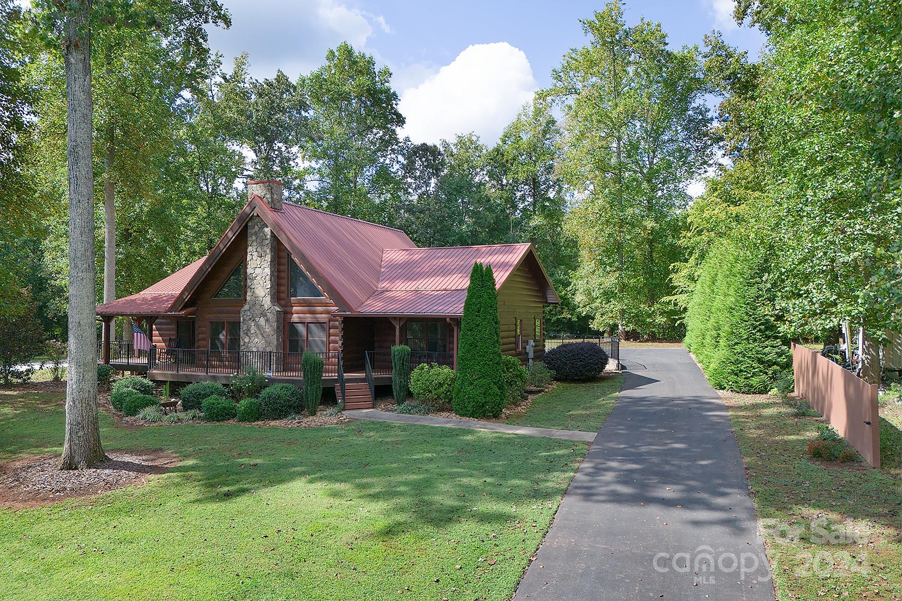 303 Lakeview Road Mocksville, NC 27028 - Photo 2 of 47 a view of a house with a yard and plants