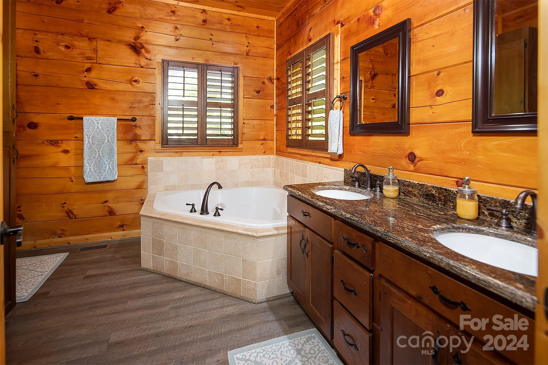 303 Lakeview Road Mocksville, NC 27028 - Photo 22 of 47 a bathroom with a granite countertop sink and a bathtub