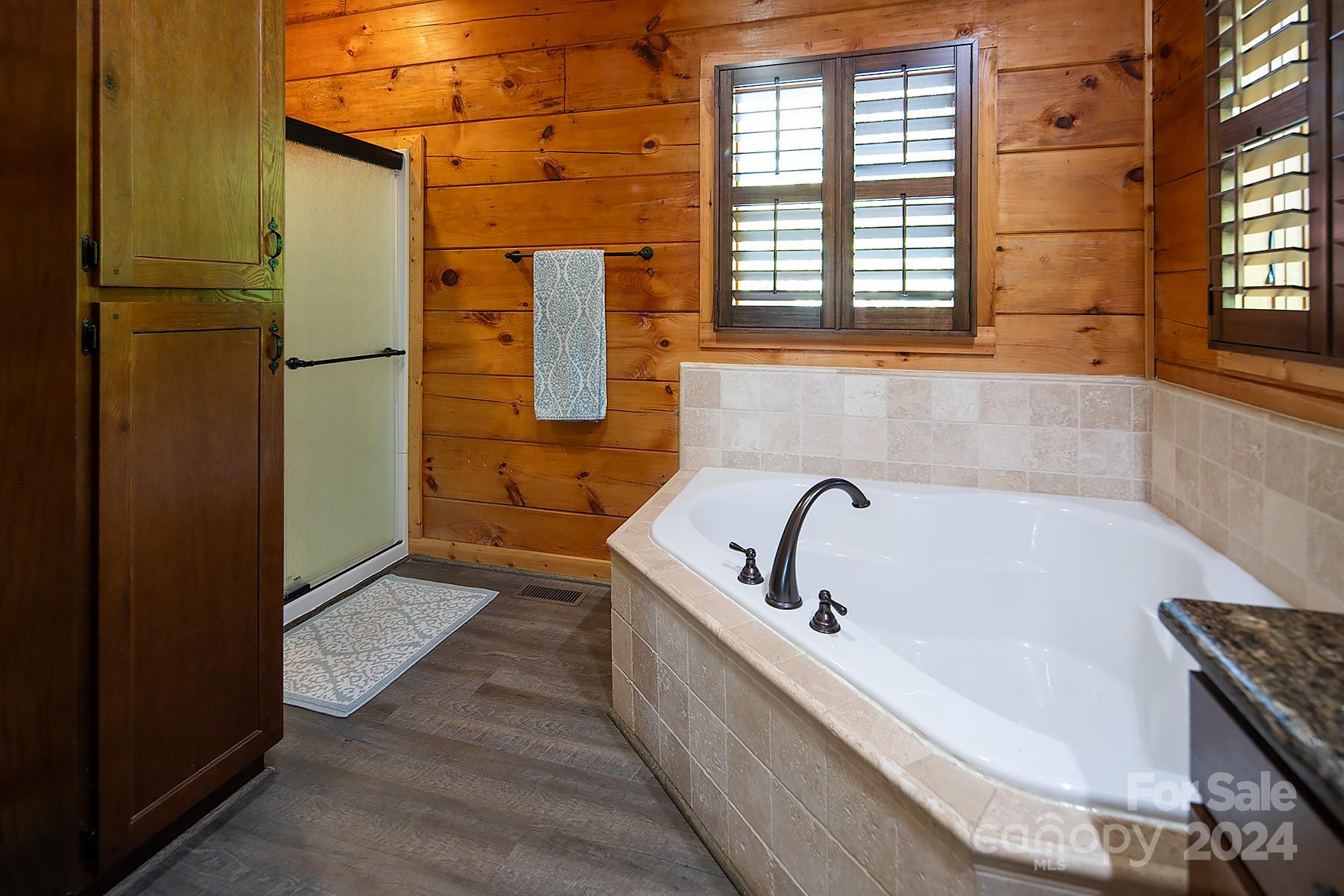 303 Lakeview Road Mocksville, NC 27028 - Photo 23 of 47 a bathroom with a bathtub and window