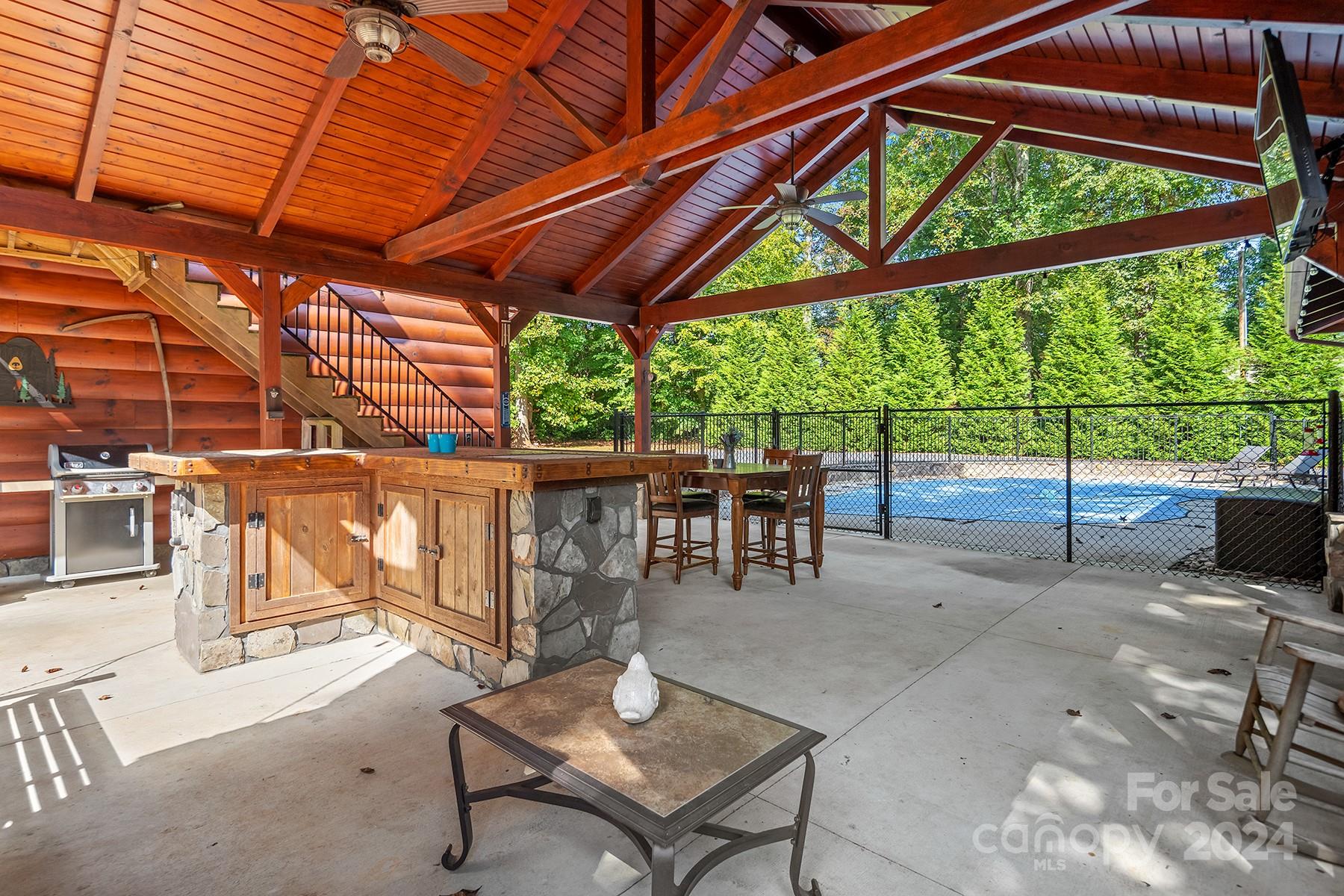 303 Lakeview Road Mocksville, NC 27028 - Photo 31 of 47 a view of yard with table and chairs under an umbrella