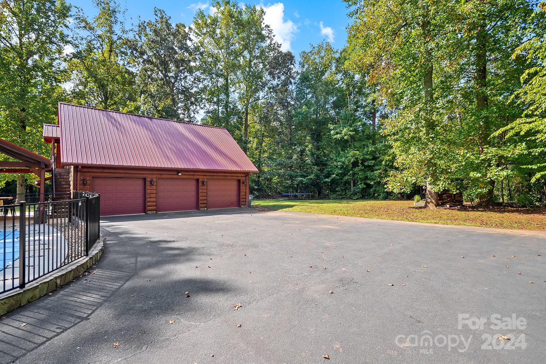 303 Lakeview Road Mocksville, NC 27028 - Photo 41 of 47 a view of house with outdoor space area and tree