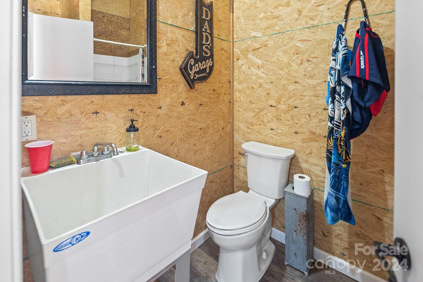 303 Lakeview Road Mocksville, NC 27028 - Photo 42 of 47 a white toilet sitting next to a bathroom sink