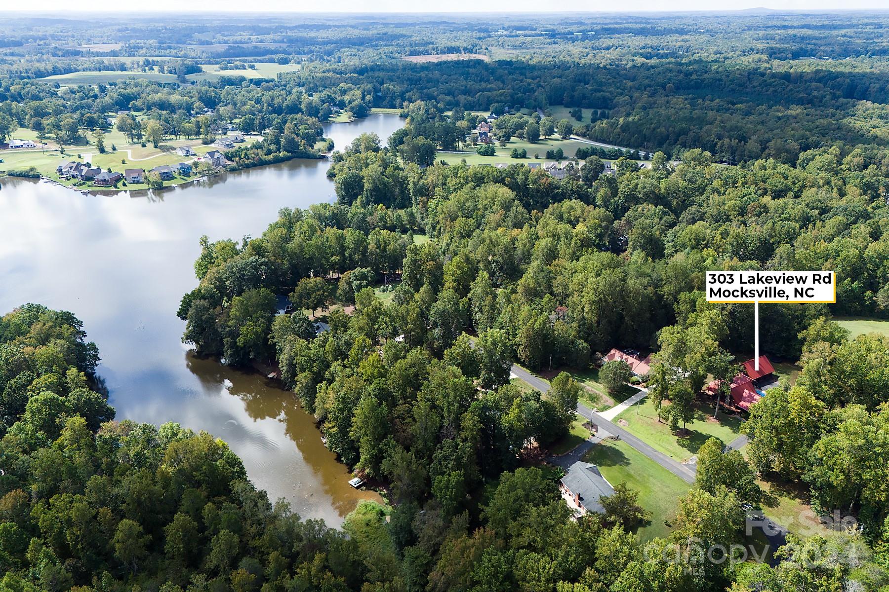 303 Lakeview Road Mocksville, NC 27028 - Photo 43 of 47 an aerial view of a houses with a lake view
