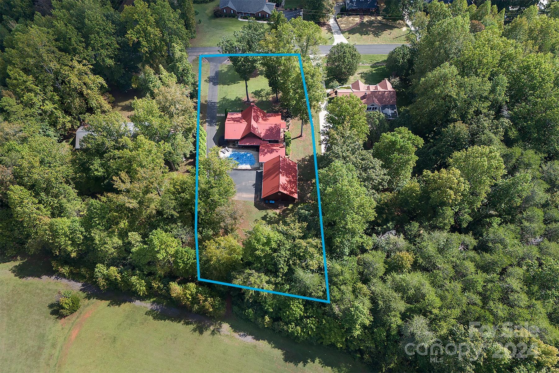 303 Lakeview Road Mocksville, NC 27028 - Photo 44 of 47 an aerial view of residential house with outdoor space and trees all around