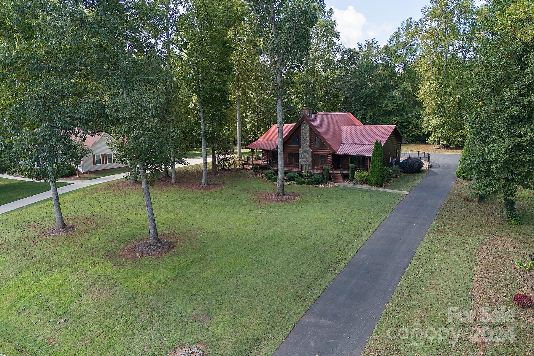 303 Lakeview Road Mocksville, NC 27028 - Photo 46 of 47 a front view of a house with a yard and tree