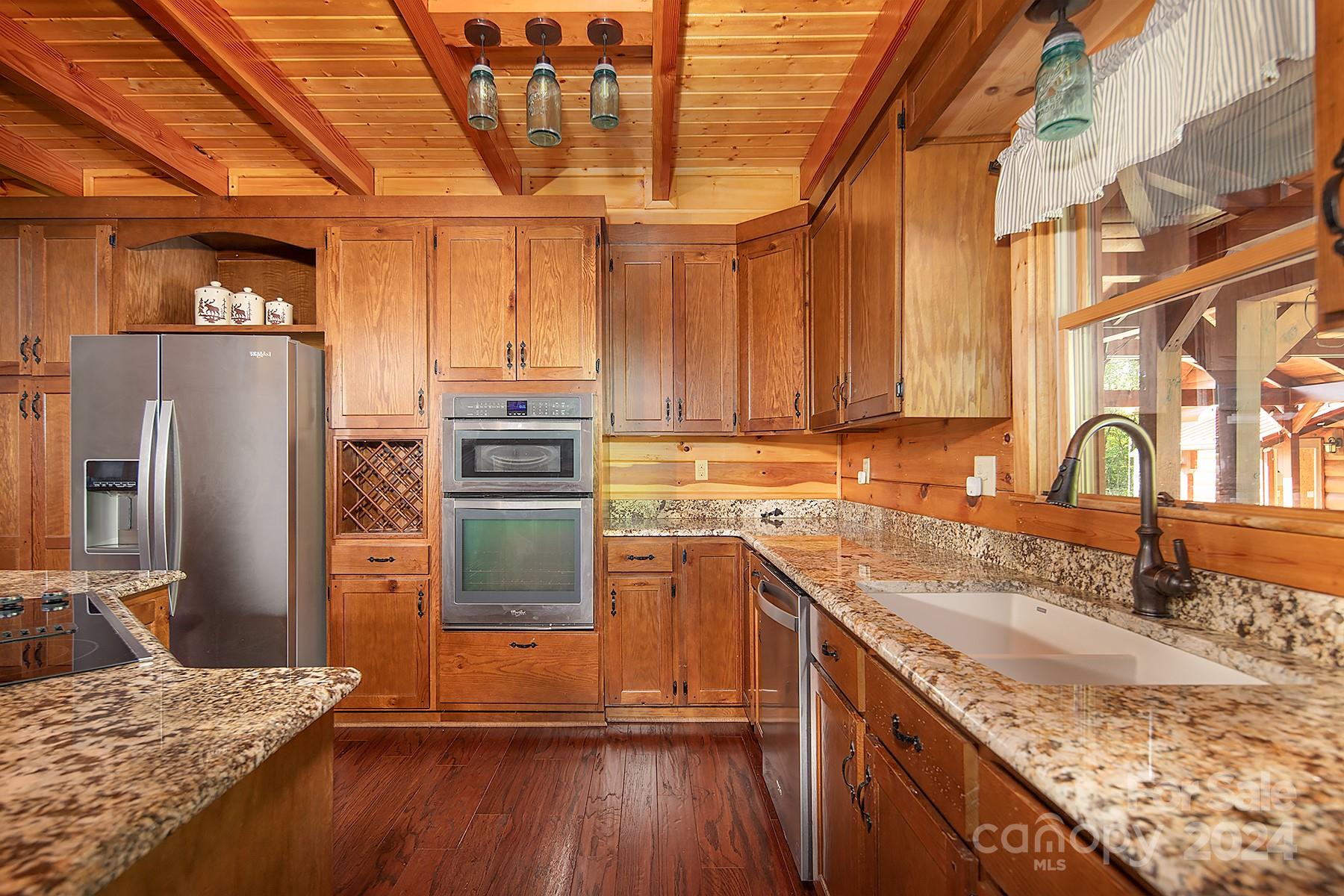 303 Lakeview Road Mocksville, NC 27028 - Photo 5 of 47 a kitchen with stainless steel appliances granite countertop a sink a stove and refrigerator