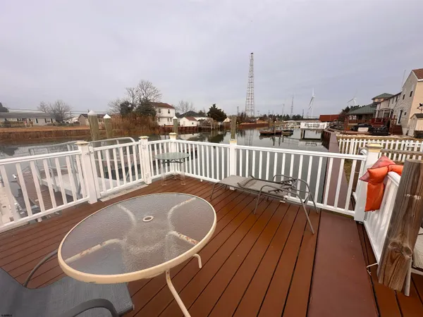 swimming pool view with a seating space