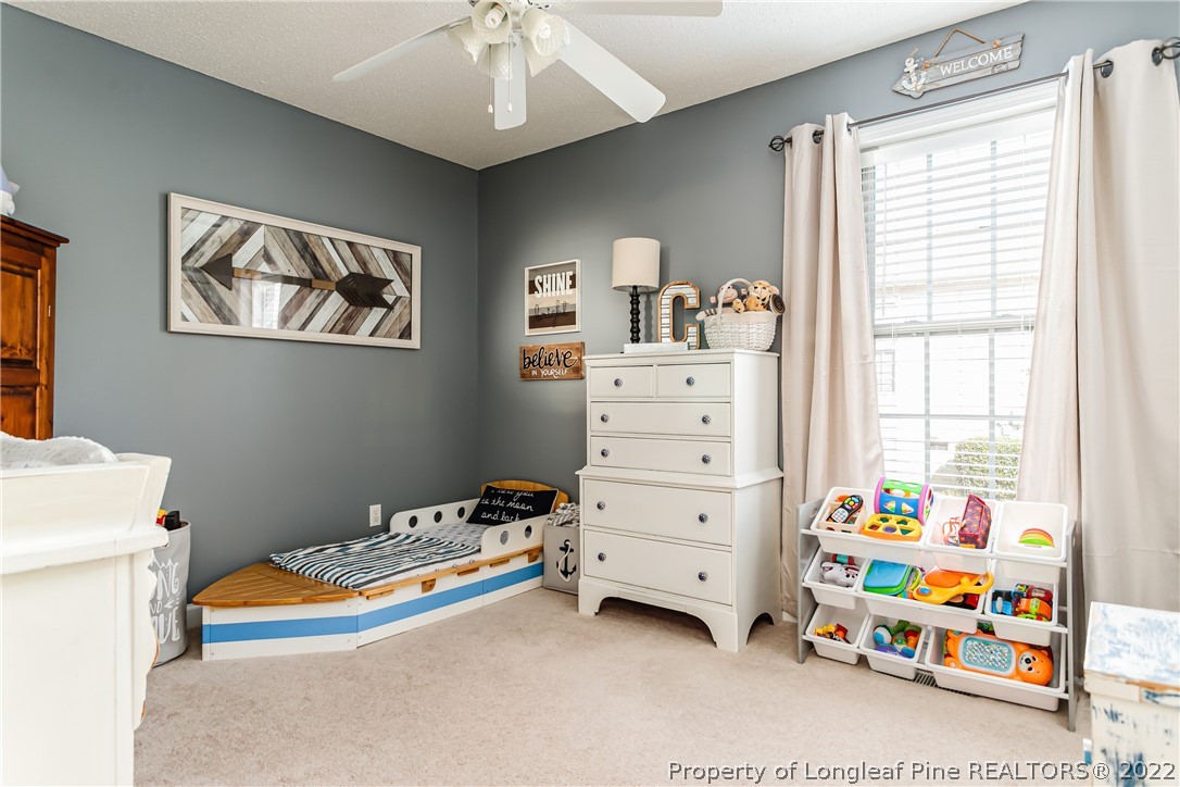 23 Beryl Circle Pinehurst, NC 28374 - Photo 20 of 29 a bedroom with a bed and a dresser