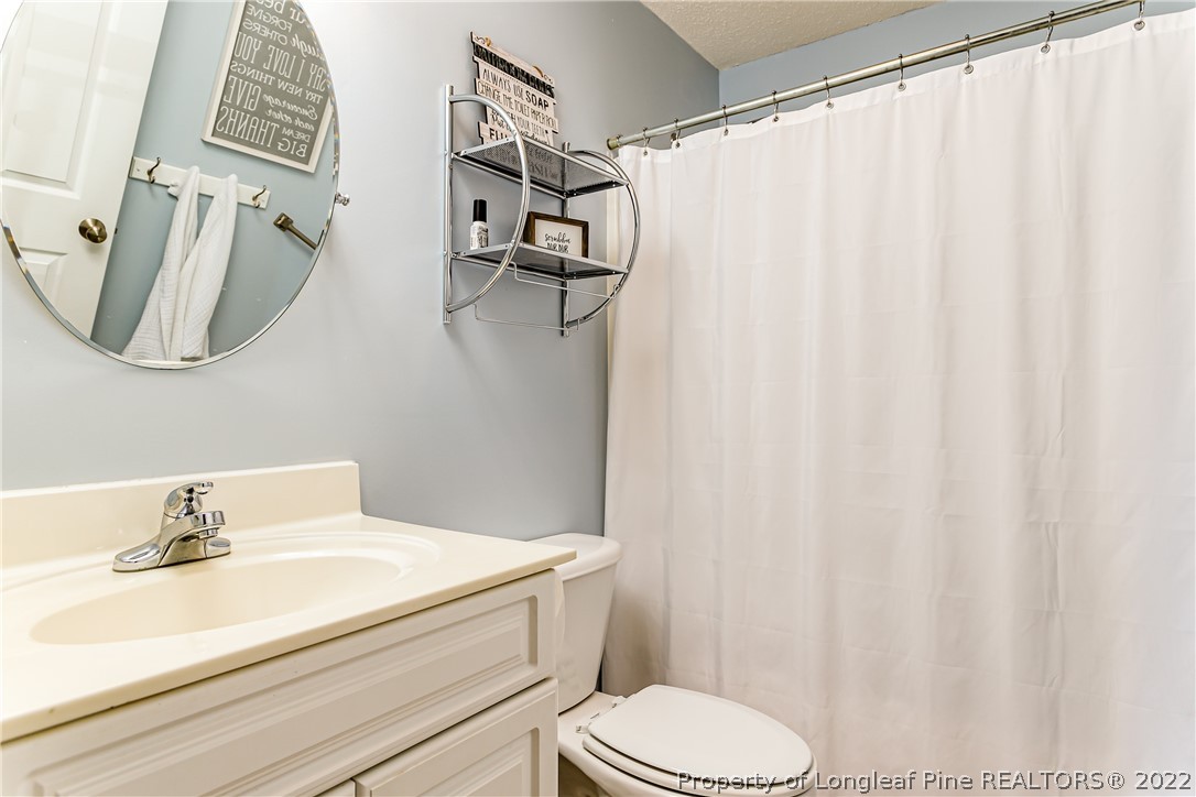 23 Beryl Circle Pinehurst, NC 28374 - Photo 21 of 29 a bathroom with a sink and toilet
