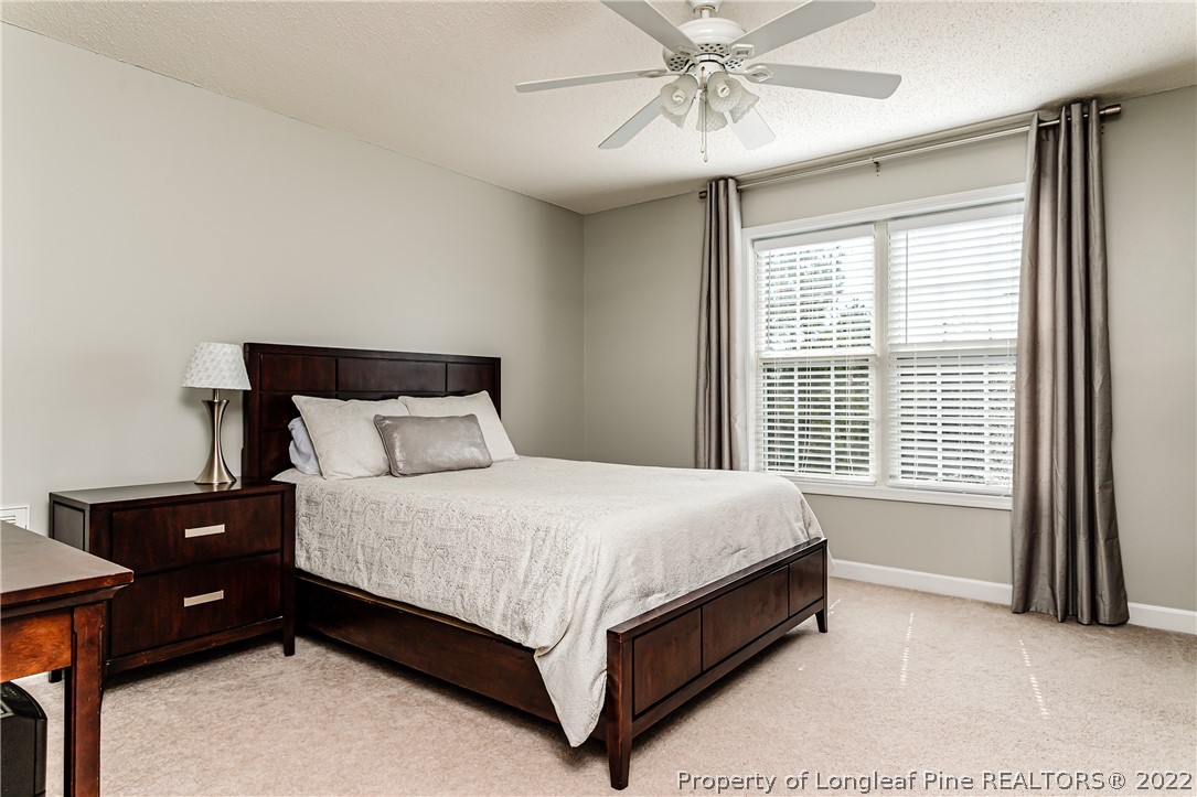 23 Beryl Circle Pinehurst, NC 28374 - Photo 24 of 29 a large bed sitting in a bedroom next to a window