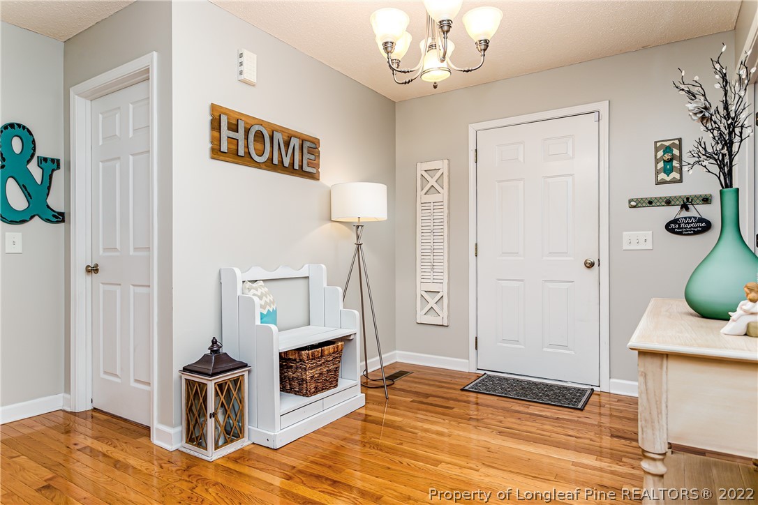23 Beryl Circle Pinehurst, NC 28374 - Photo 6 of 29 a view of a kitchen with fridge and wooden floor