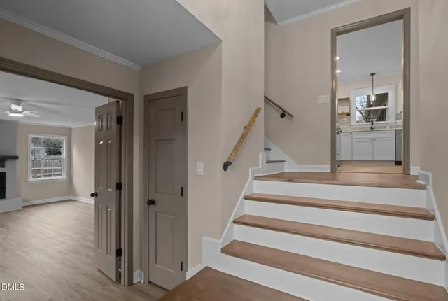 a view of staircase with white walls and stairs