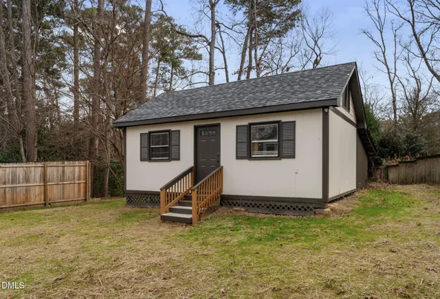 a view of an empty room with furniture