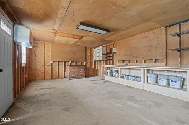 a view of backyard with barbeque grill and outdoor seating