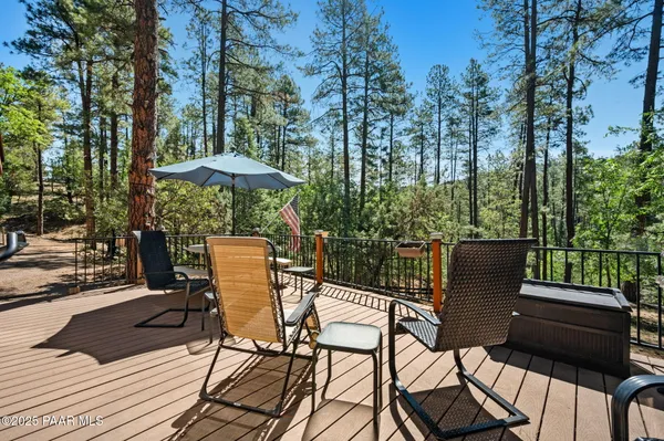 a view of backyard with sitting area