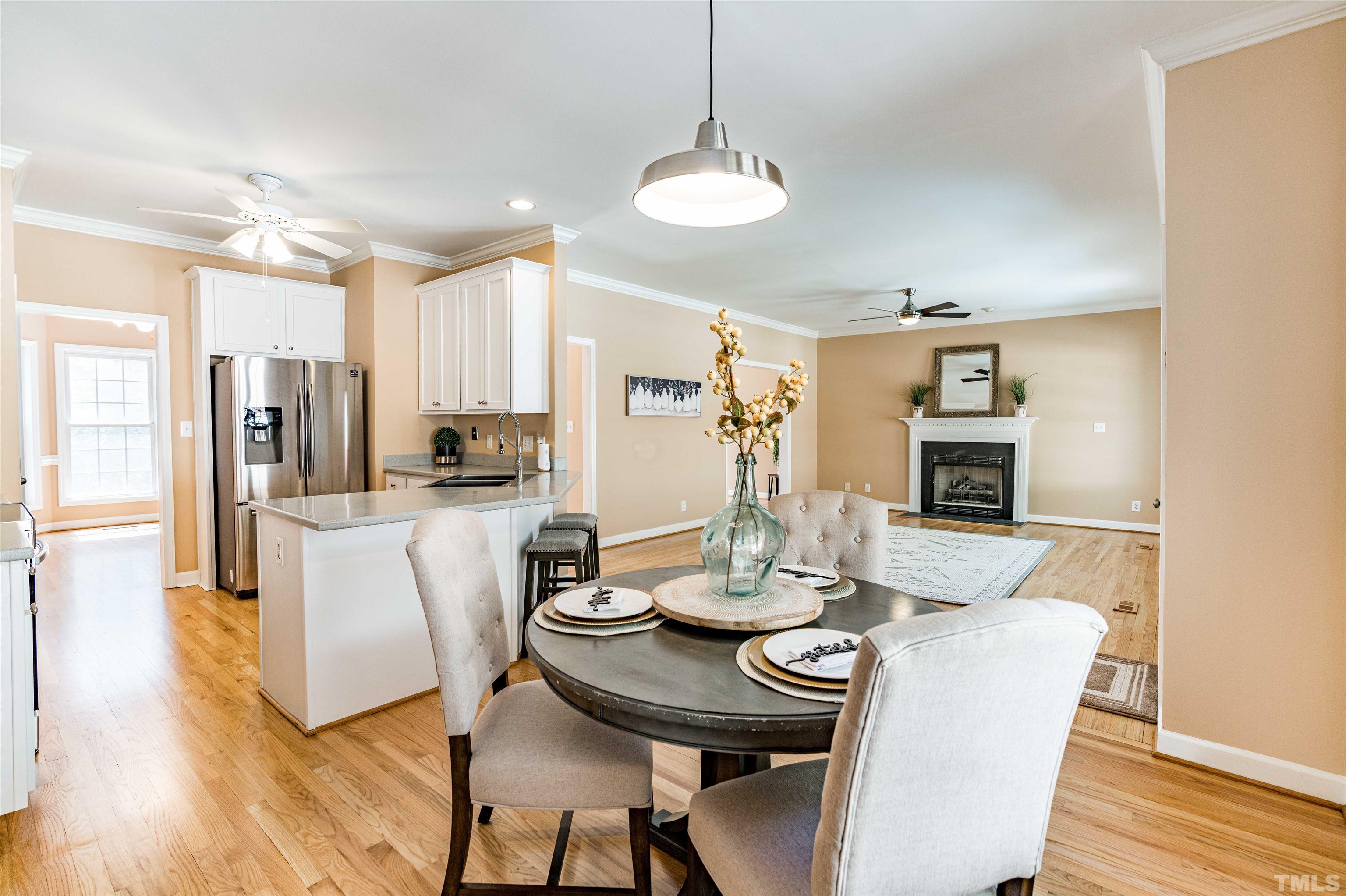 114 Marin Drive Chapel Hill, NC 27516 - Photo 14 of 27 a view of a dining room with furniture and wooden floor