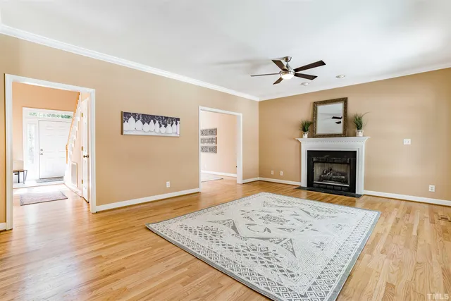 wooden floor fireplace and windows in a room