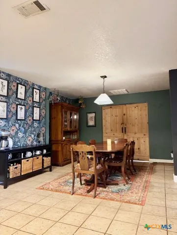 a view of a dining room with furniture