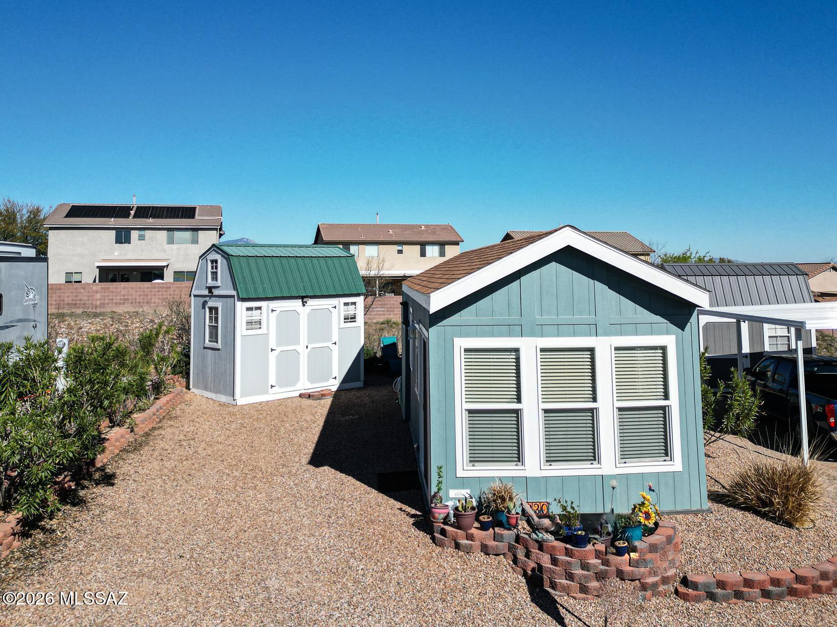 1030 Barrel Cactus Ridge, Unit 230 Benson, AZ 85602 - Photo 2 of 12 front view of a house with a yard