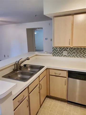 a kitchen with a sink and cabinets