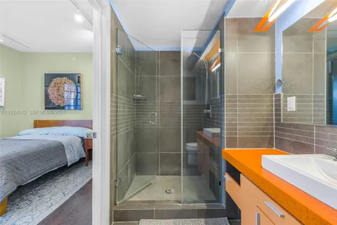 a bathroom with a bathtub and a shower