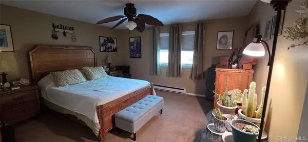 a bedroom with bed and a window