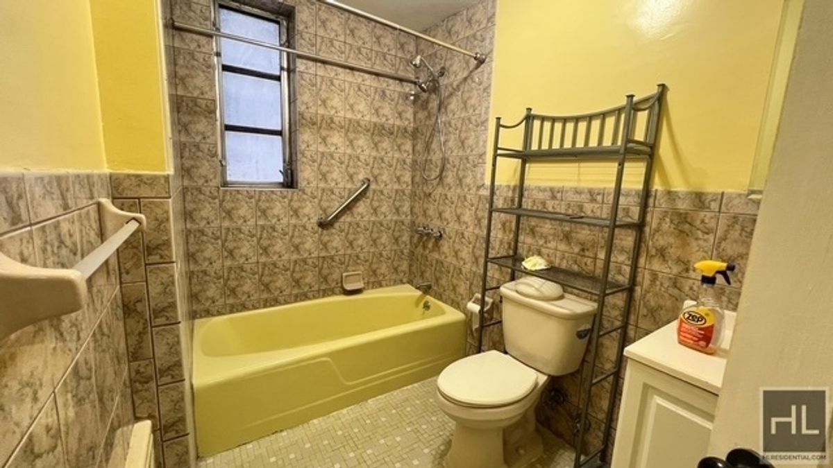 797 Lenox Road, Unit 1 Brooklyn, NY 11203 - Photo 16 of 21 a bathroom with a toilet sink and bathtub