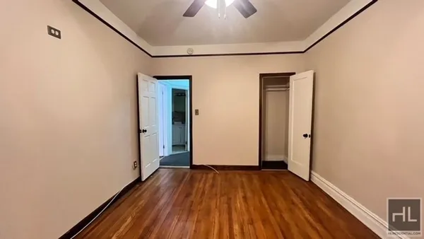 a view of a room with wooden floor