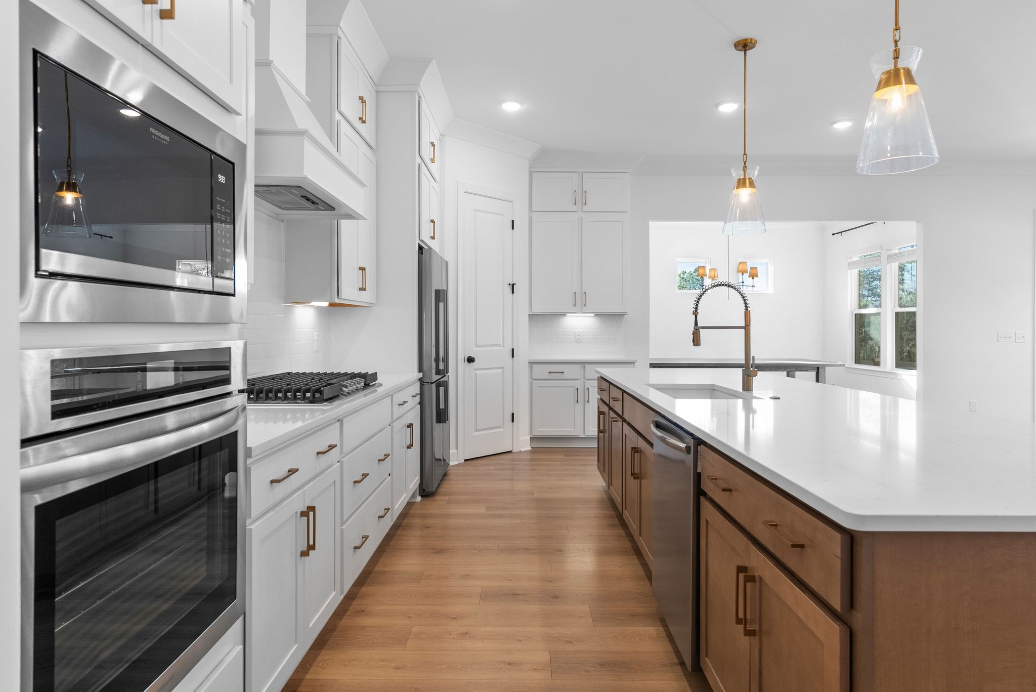 7440 Atwater Circle Fairview, TN 37062 - Photo 13 of 43 a large kitchen with stainless steel appliances kitchen island granite countertop a sink and cabinets