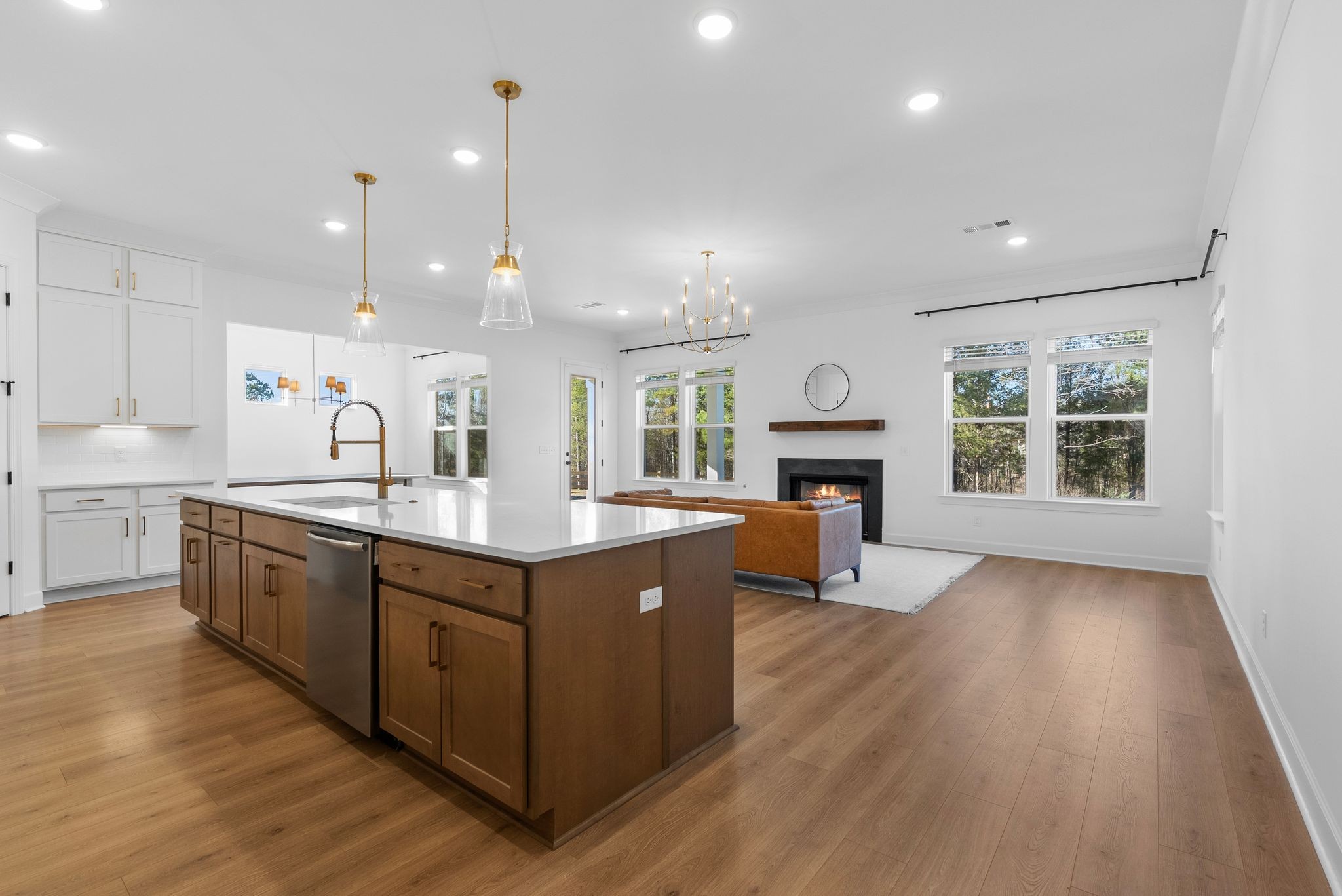 7440 Atwater Circle Fairview, TN 37062 - Photo 14 of 43 a kitchen with wooden floors and cabinets