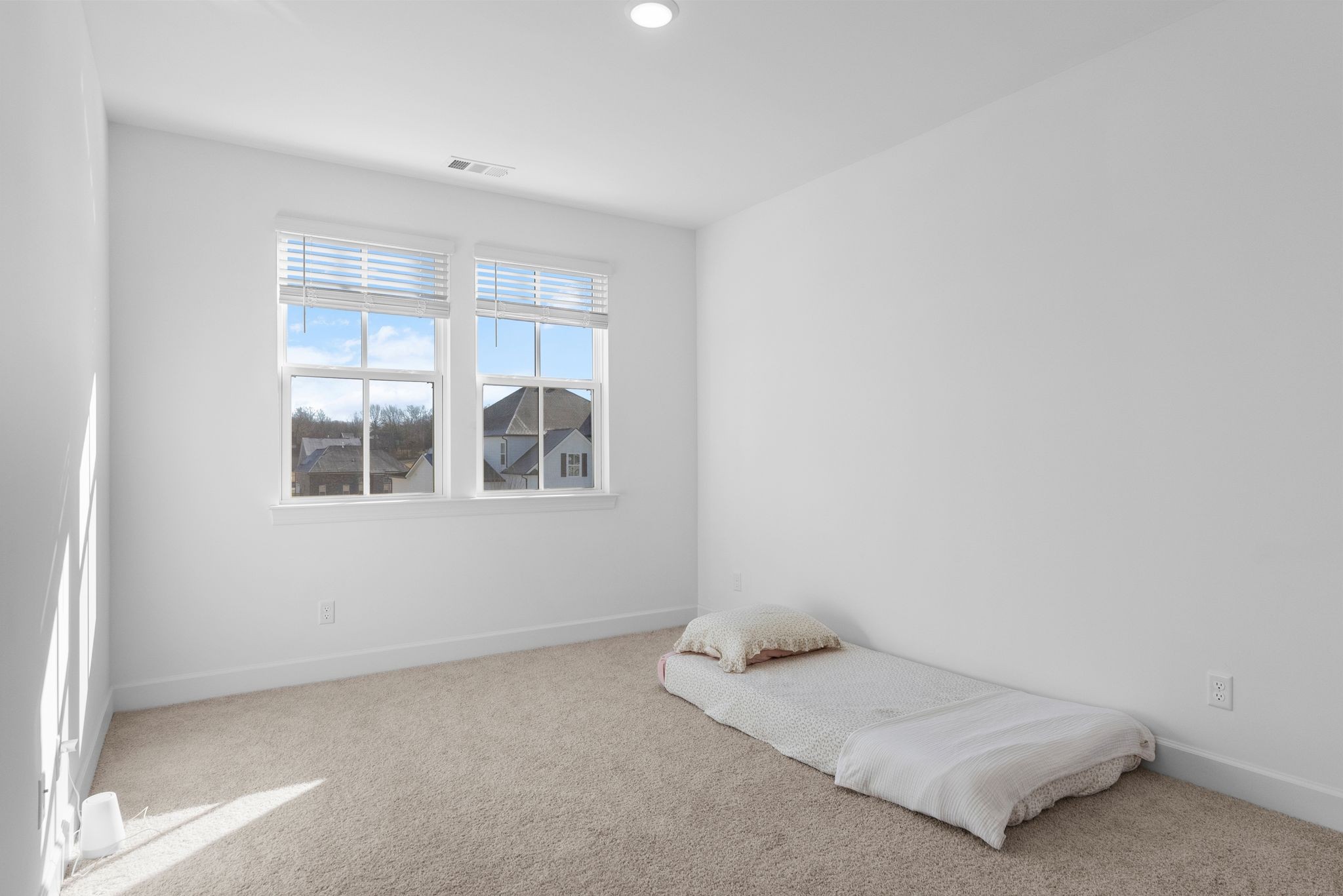 7440 Atwater Circle Fairview, TN 37062 - Photo 32 of 43 a room with a bed and a window