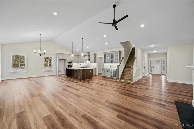 a view of a room with kitchen and stainless steel appliances