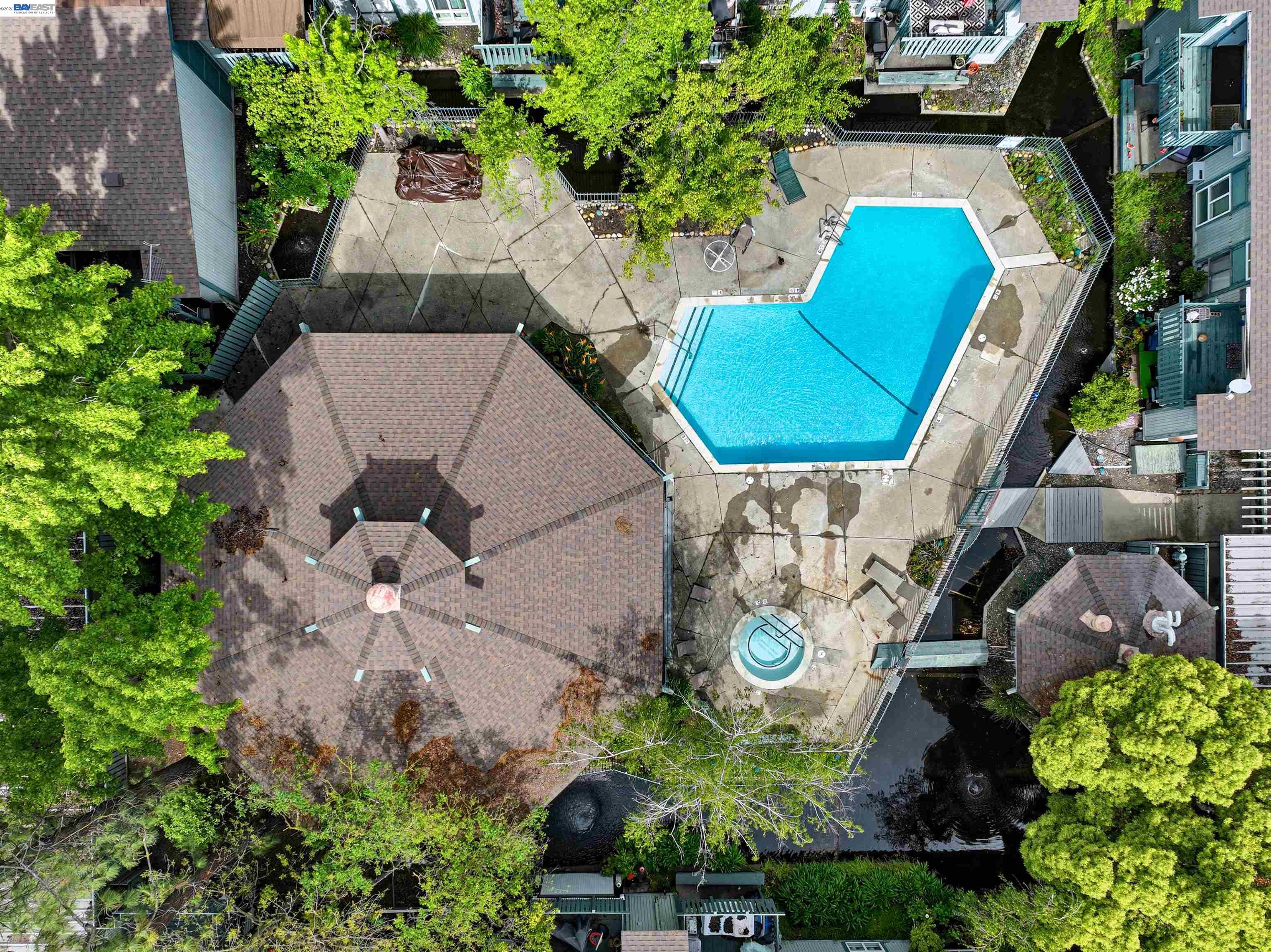 1036 Oak Grove Road, Unit 81 Concord, CA 94518 - Photo 11 of 11 an aerial view of a house with a swimming pool and garden