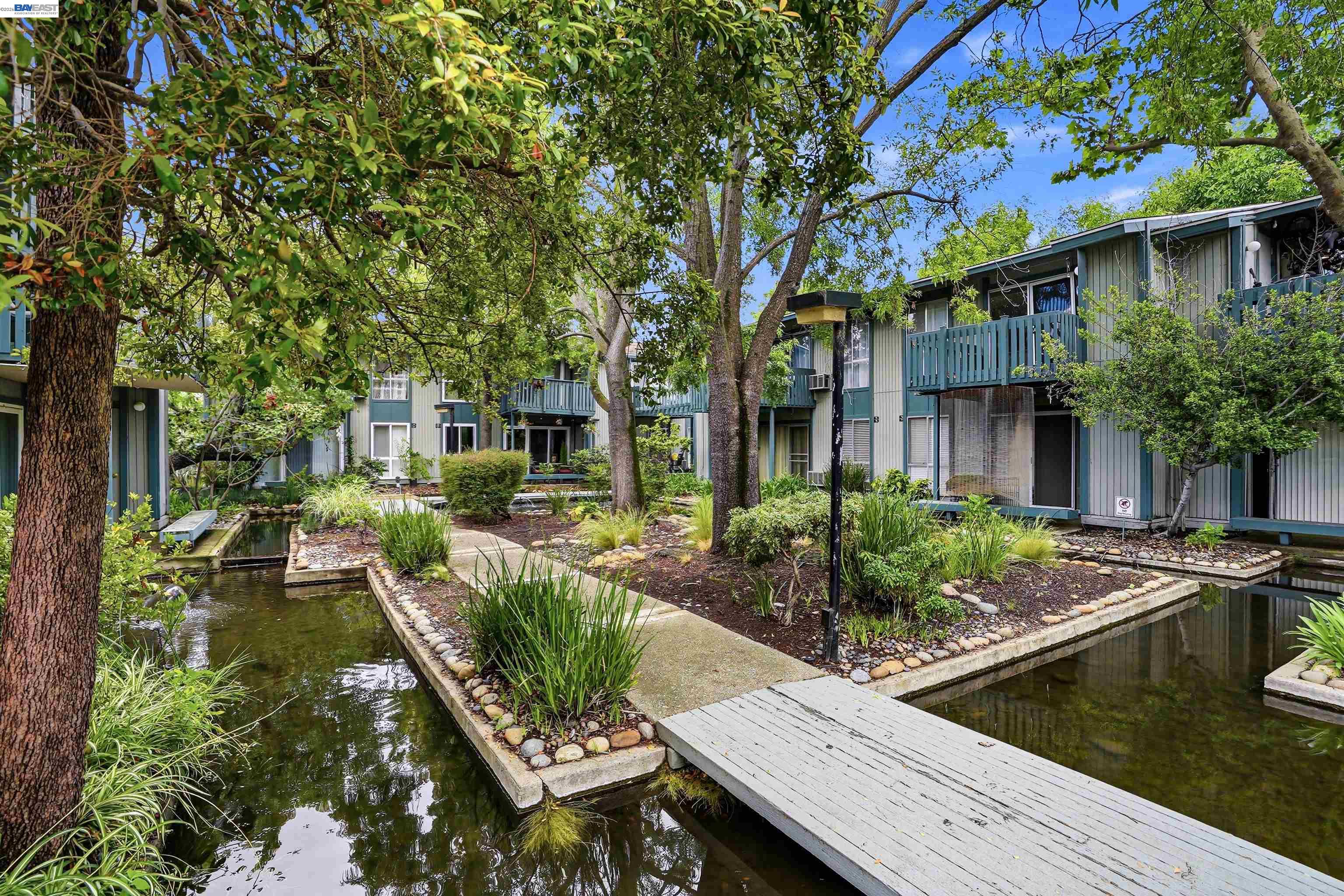 1036 Oak Grove Road, Unit 81 Concord, CA 94518 - Photo 5 of 11 a view of house with swimming pool and outdoor seating
