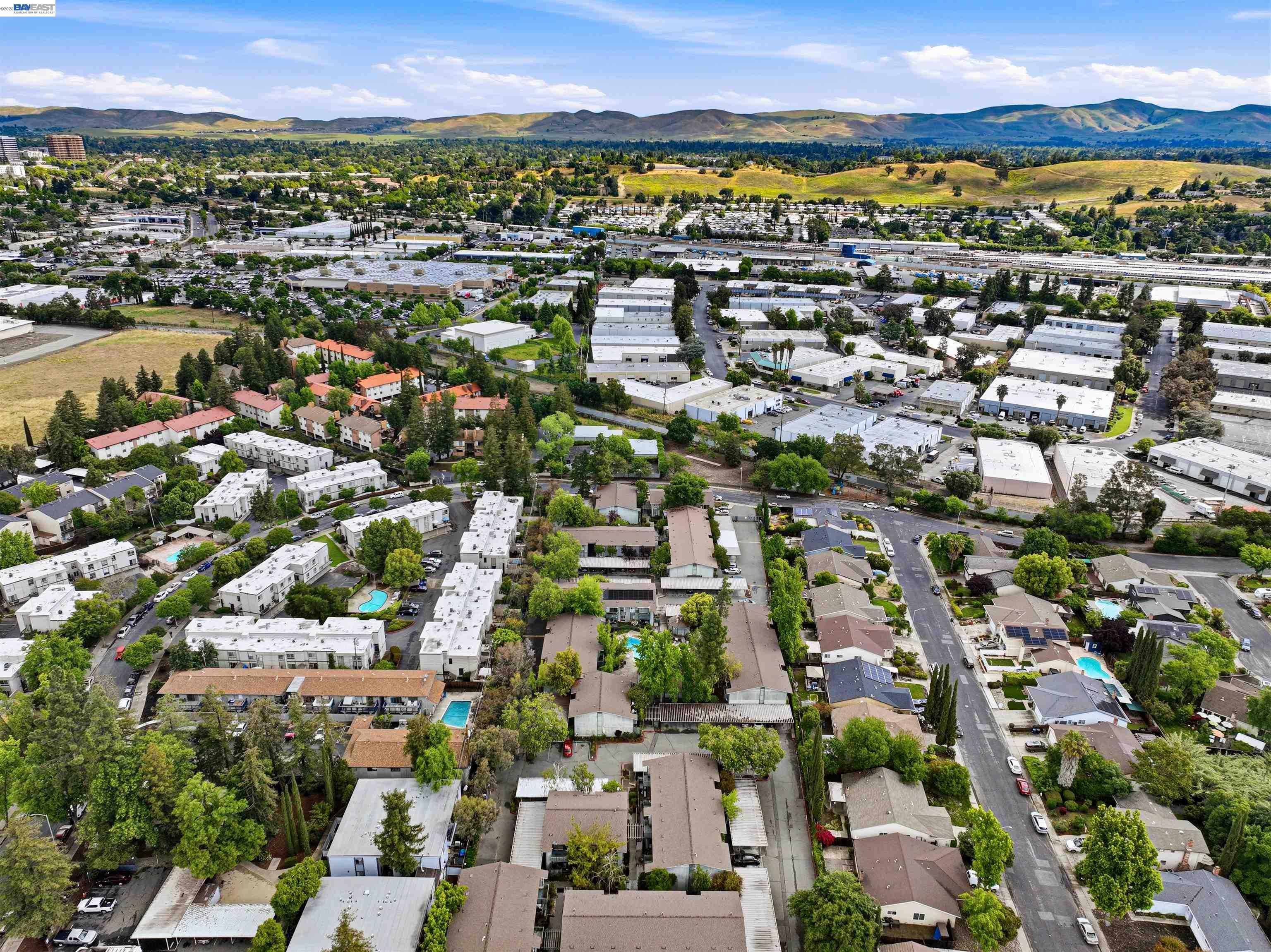 1036 Oak Grove Road, Unit 81 Concord, CA 94518 - Photo 7 of 11 a view of a city with lots of residential buildings and mountain view in back