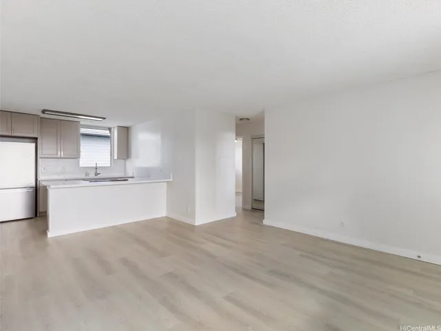a view of a kitchen with wooden floor