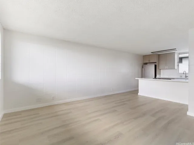 a view of kitchen with wooden floor