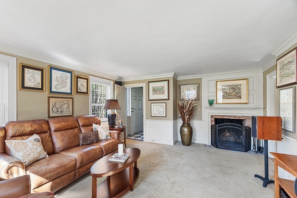 65 Lawrence Road Boxford, MA 01921 - Photo 18 of 36 a living room with furniture a window and a fireplace